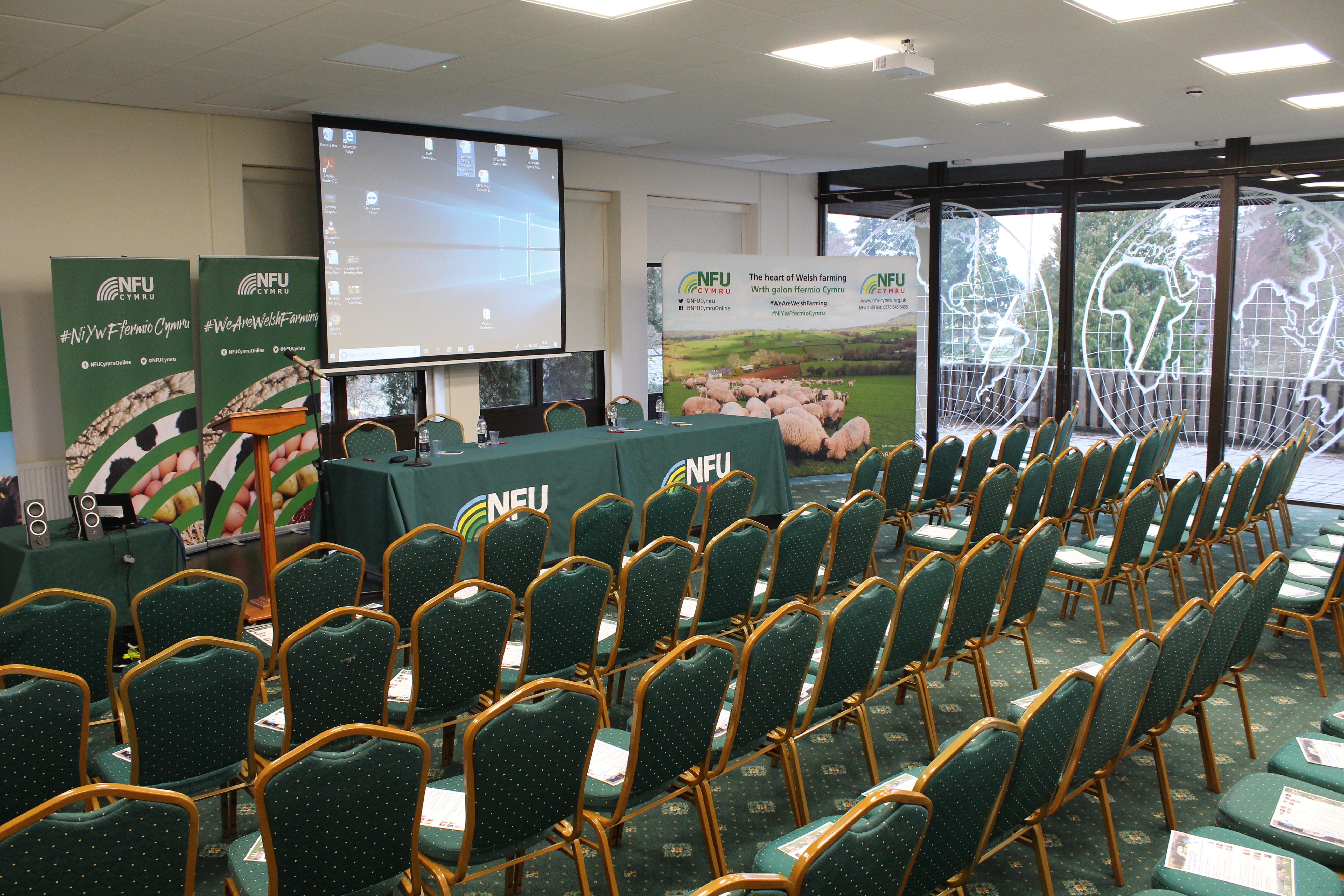 International Pavilion conference setup with stage and seating for networking event.