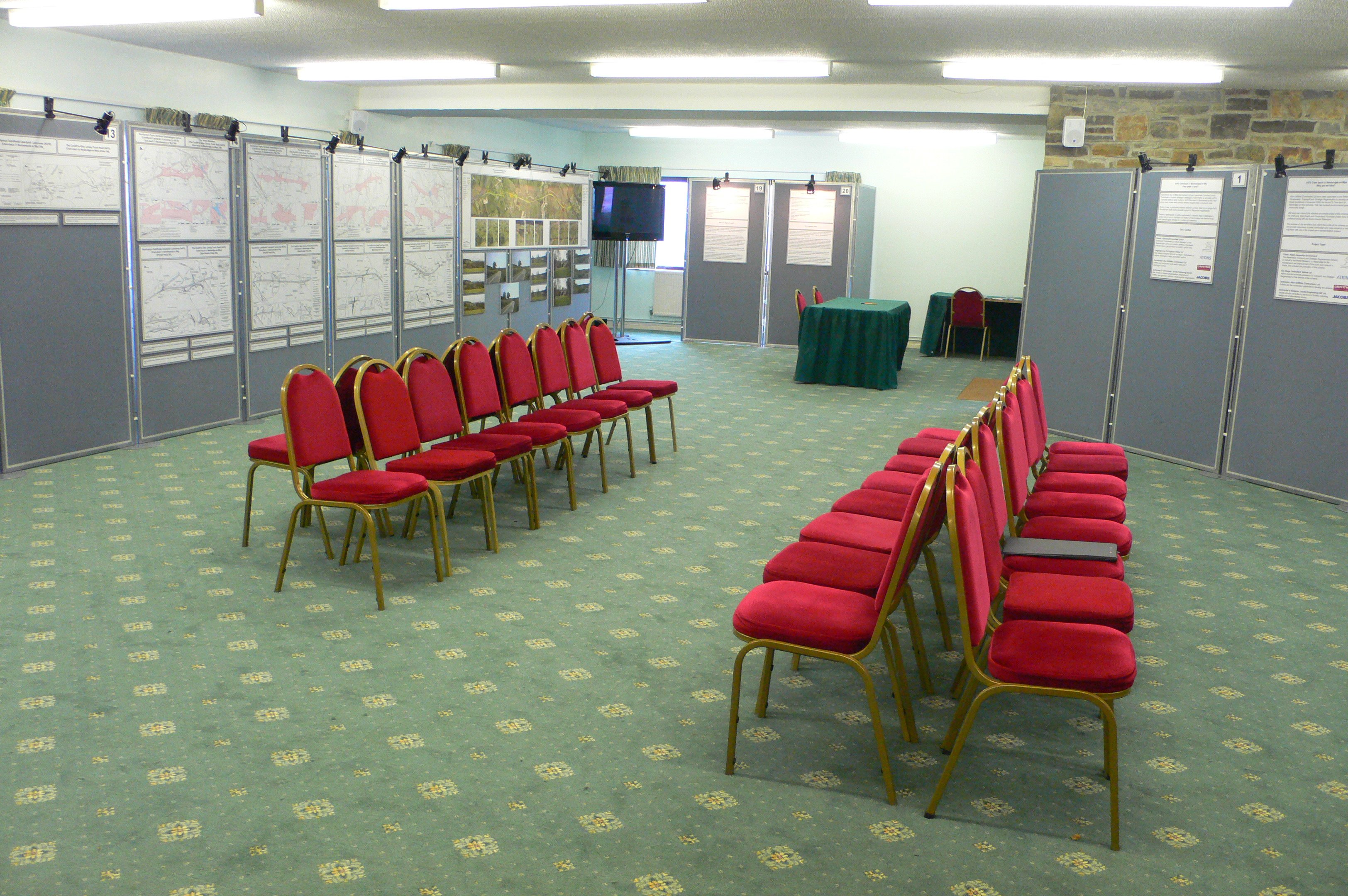 International Pavilion meeting space with red chairs, ideal for workshops and presentations.
