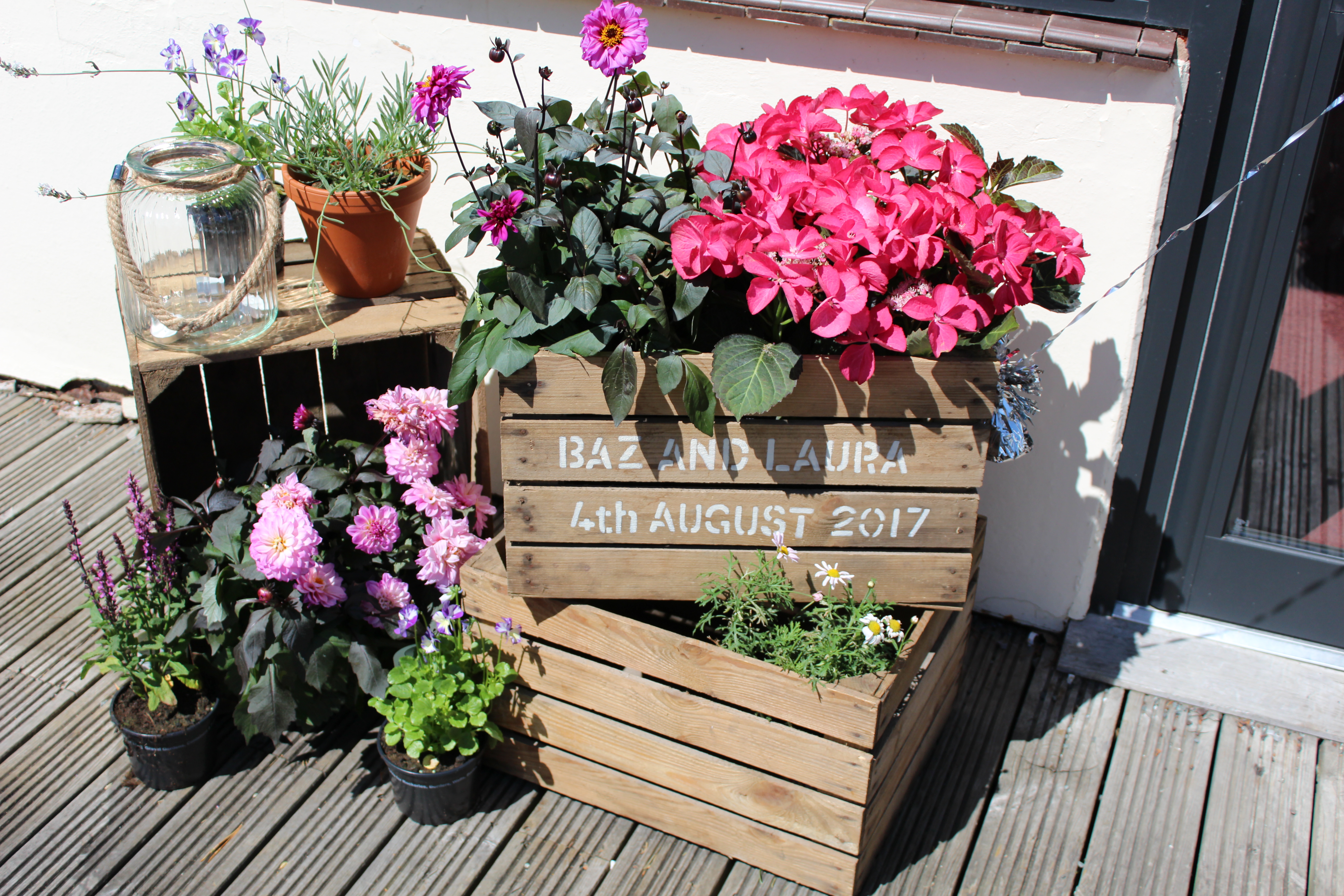 Montgomeryshire Pavilion with floral crates, perfect for outdoor weddings and events.
