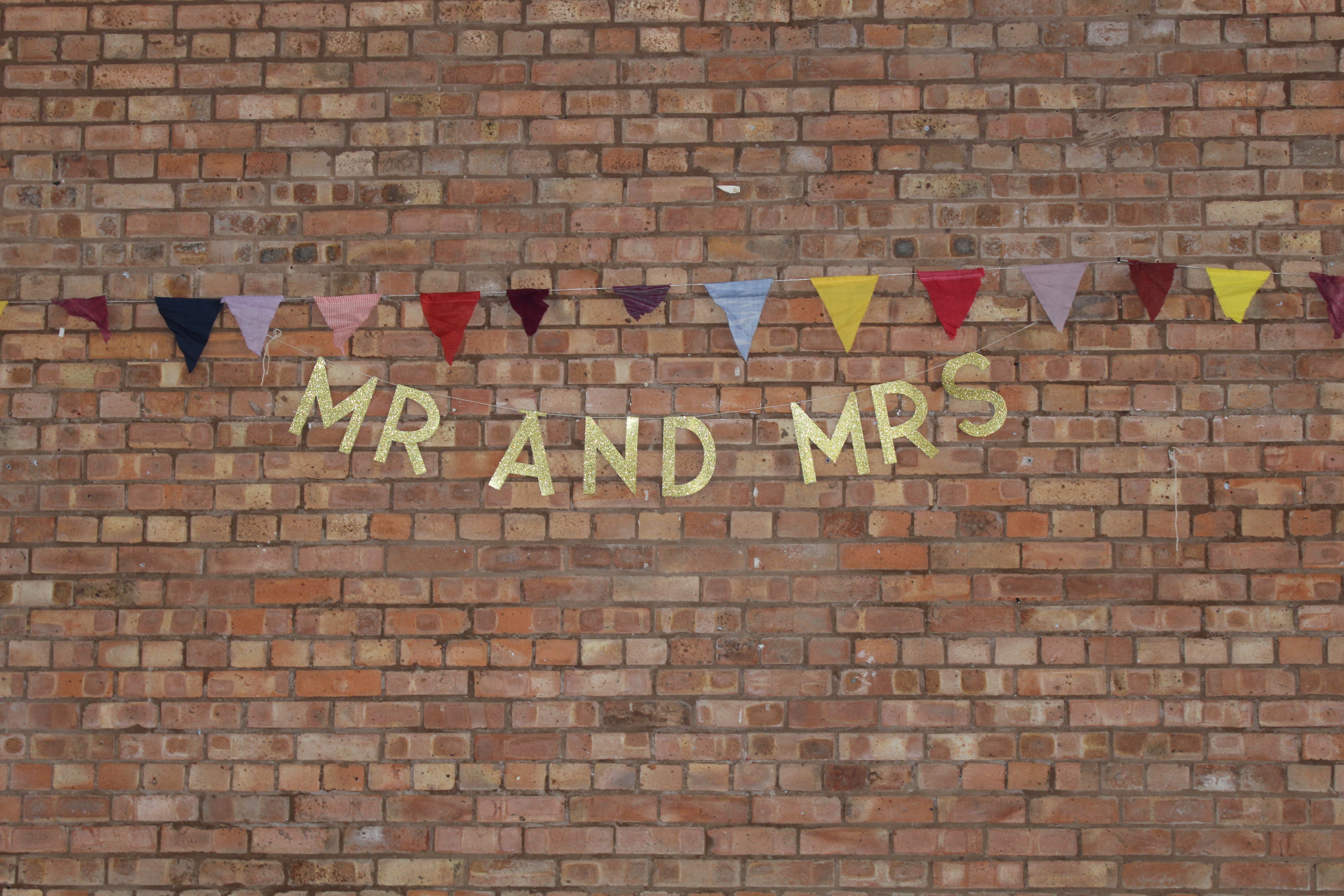 Montgomeryshire Pavilion with rustic brick wall, perfect for weddings and celebrations.