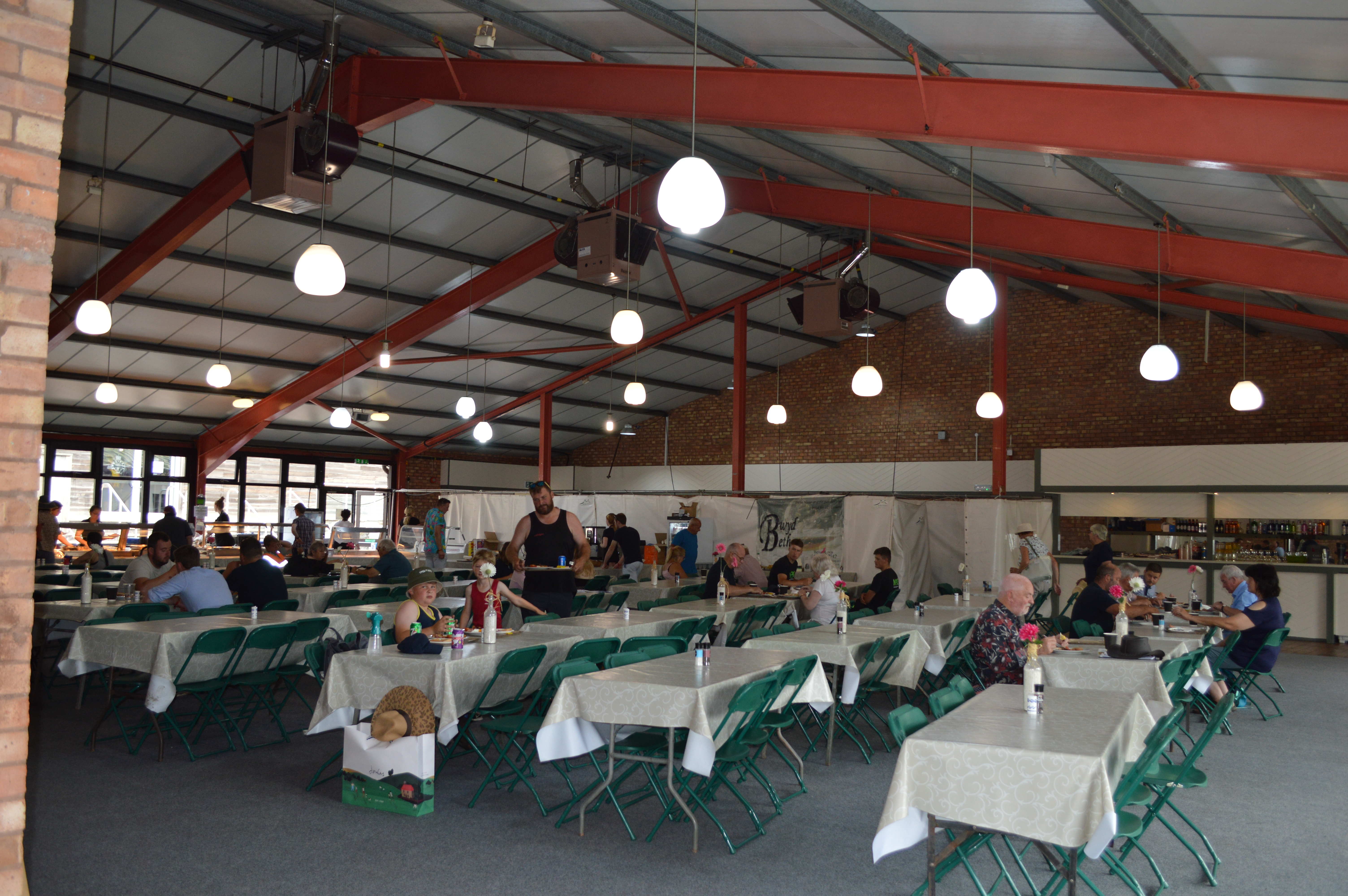 Montgomeryshire Pavilion: spacious event venue with natural light for gatherings and dining.