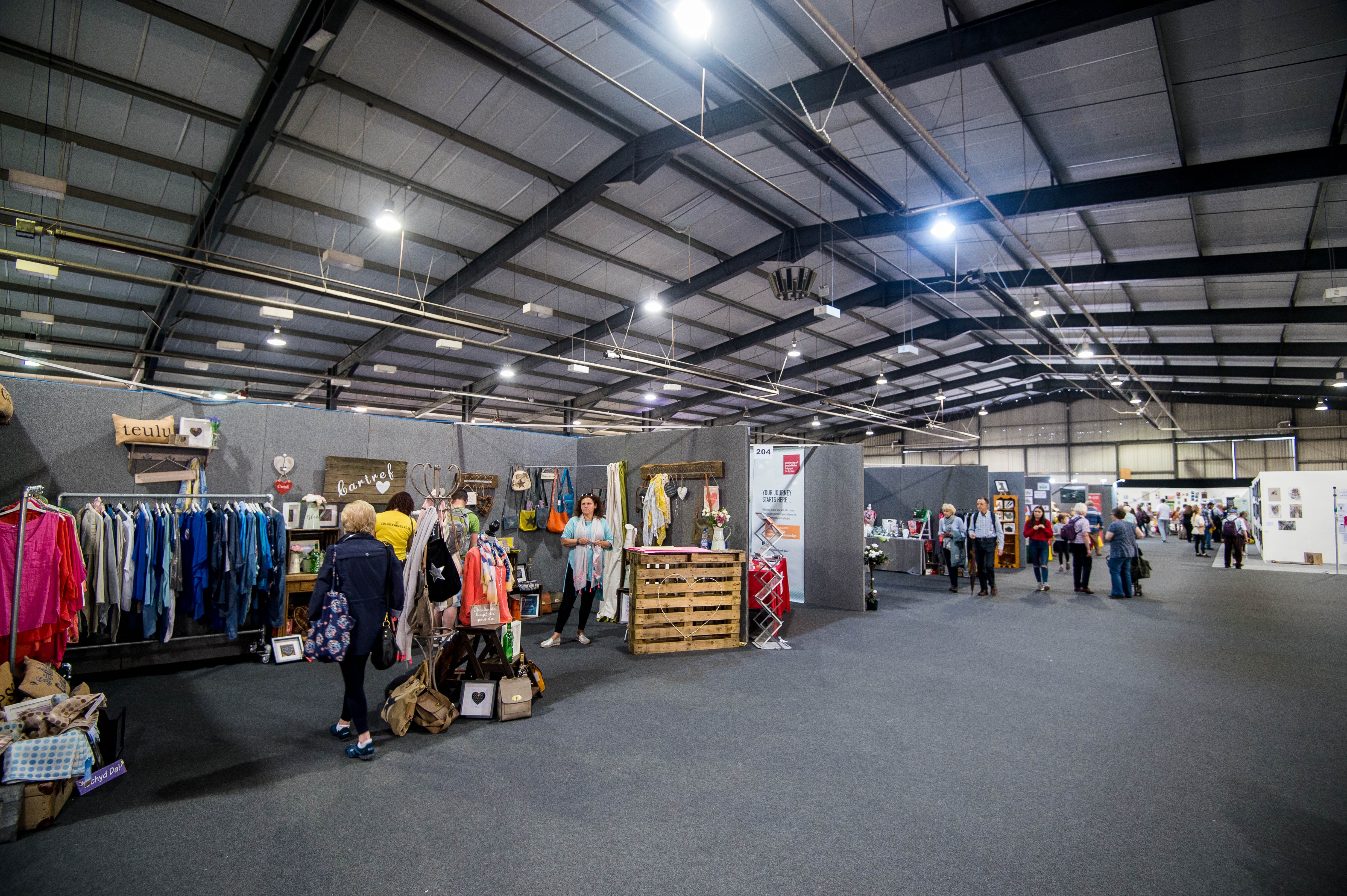 South Glamorgan Hall at Royal Welsh Showground, vibrant trade show with vendor booths.