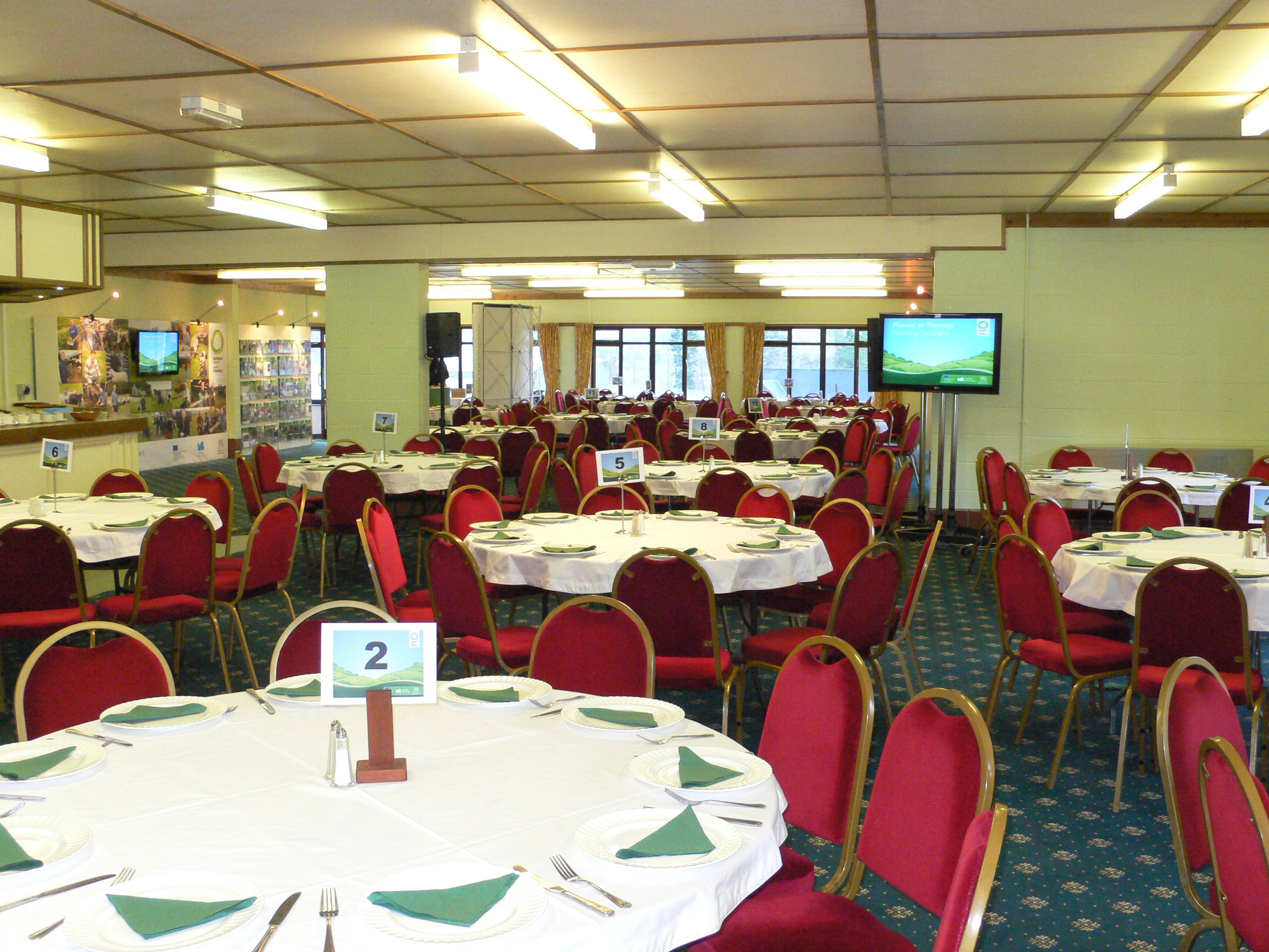 Hafod a Hendre event space with round tables, ideal for banquets and conferences.