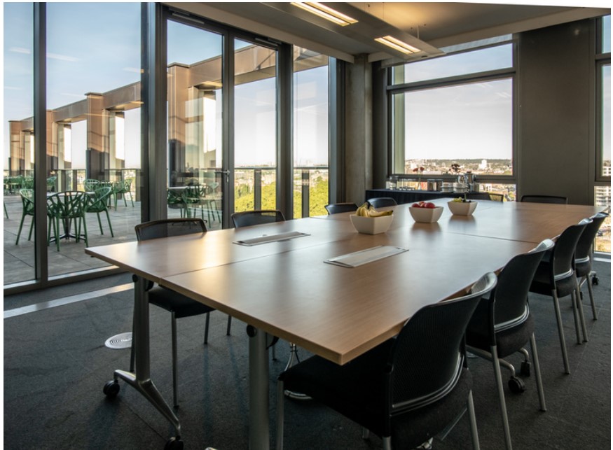 Modern meeting room with large windows at 5 Pancras Square, ideal for professional events.