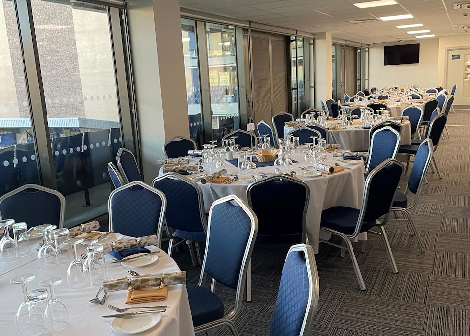 Platinum Lounge at AFC Wimbledon, elegant dining setup for corporate and celebratory events.