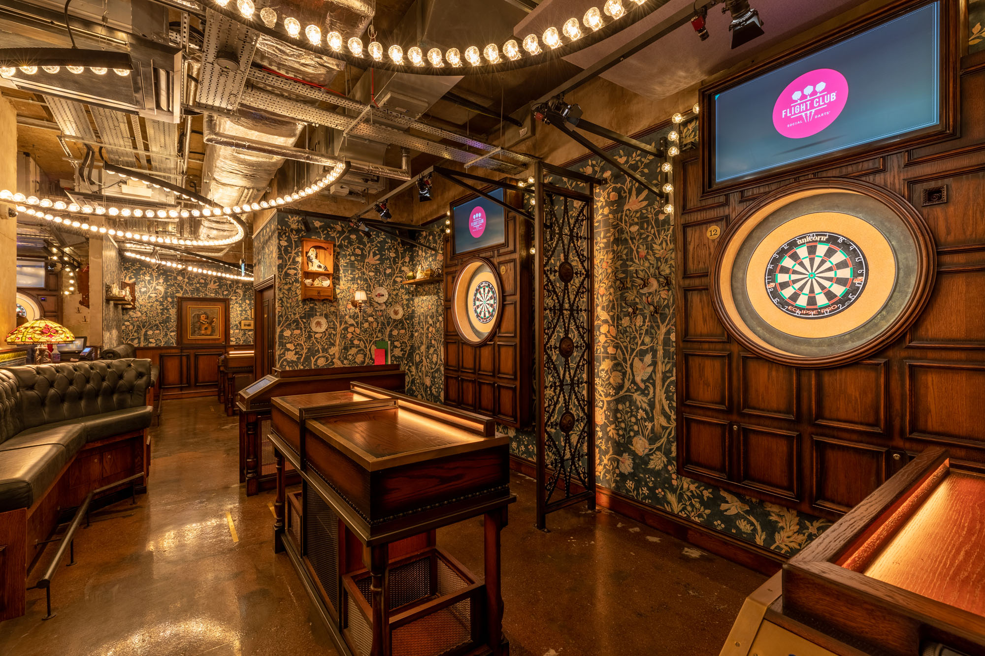 Stylish event space with dartboards in Flight Club Leeds for team-building and social events.