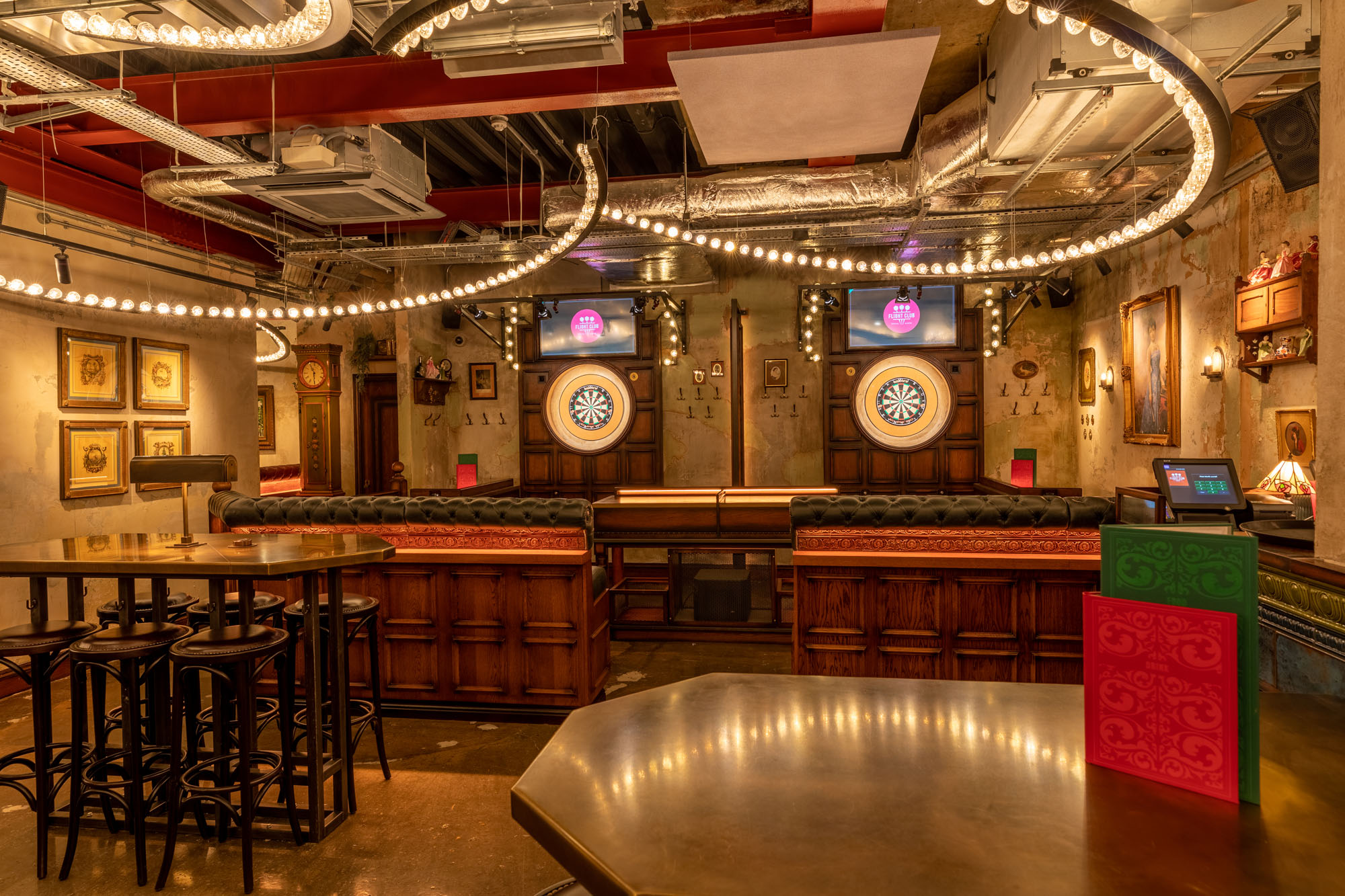 Stylish event space with dartboards in Flight Club Leeds for networking and team-building.