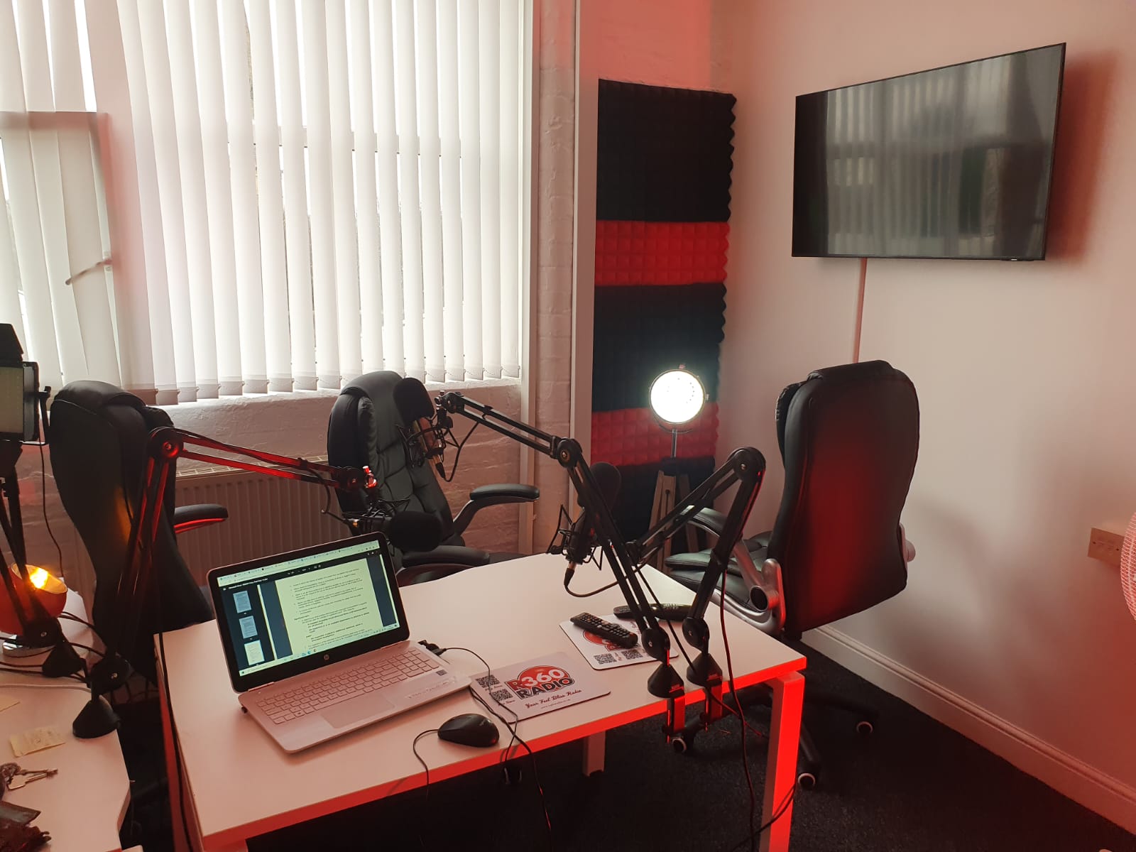 Modern R360 Podcast Studio with ergonomic chairs for virtual events and podcasts.