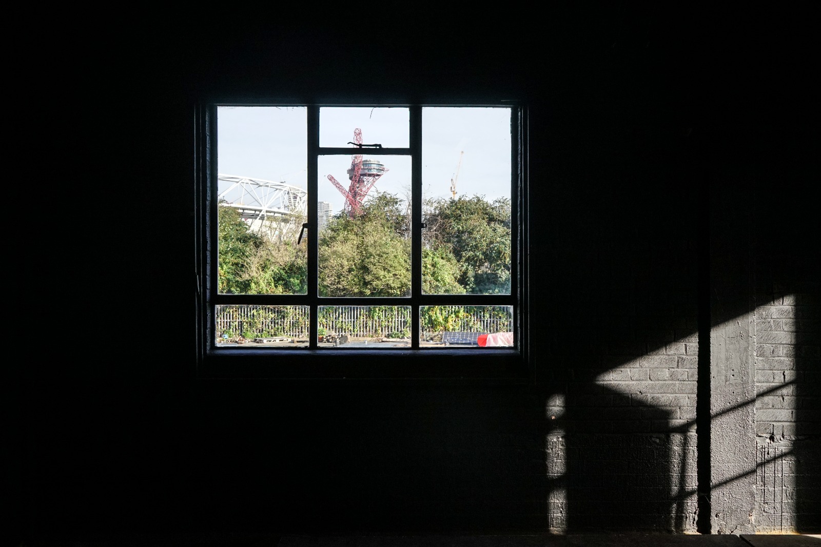 Black Box Studio window view, urban greenery, ideal for creative events and gatherings.