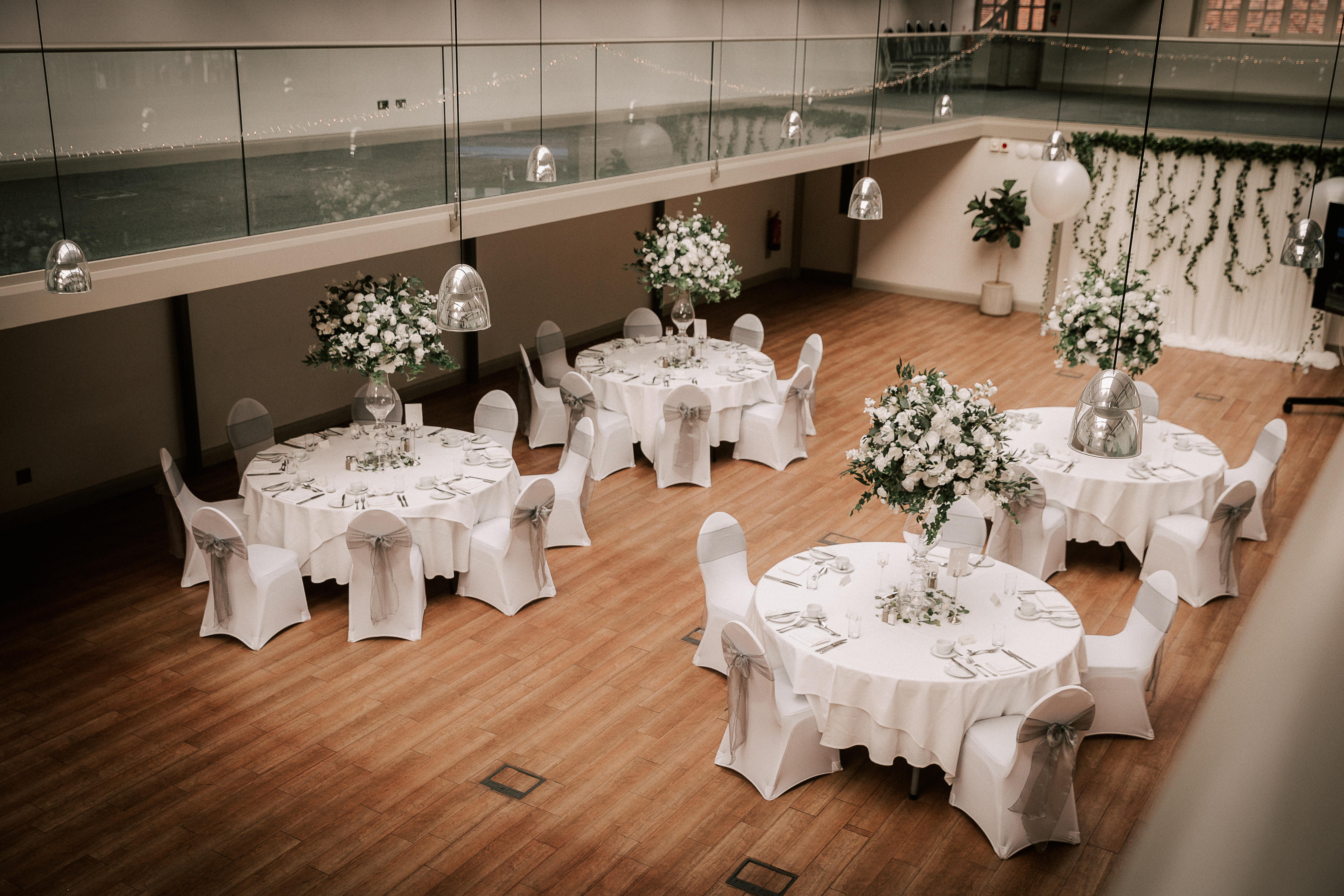 Elegant event space at Hatfield House with round tables, ideal for weddings and gatherings.