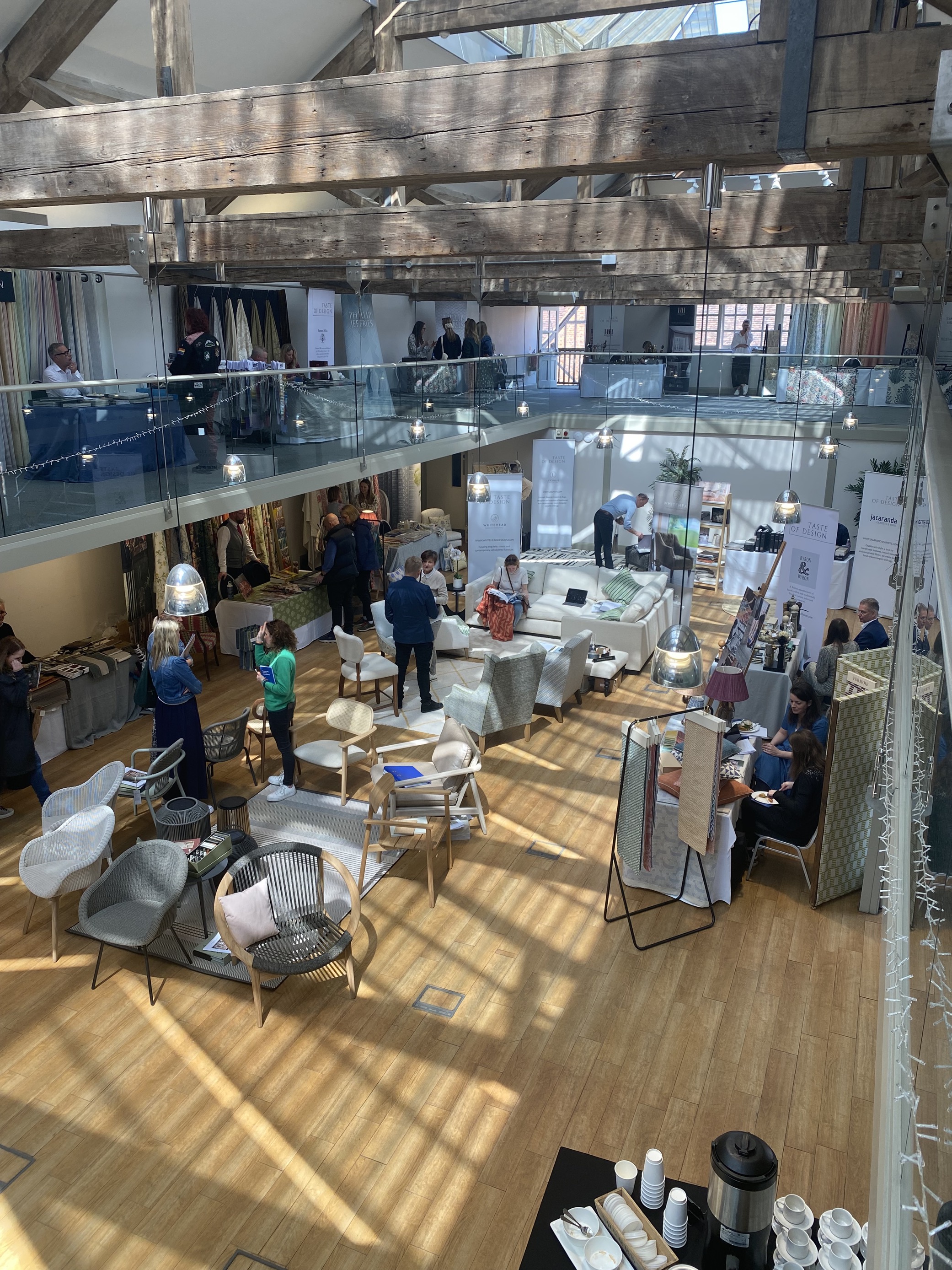 Vibrant event space at Hatfield House with exhibitors, ideal for networking and meetings.