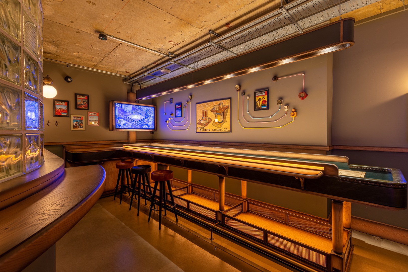 Modern event space in Electric Shuffle Leeds with sleek bar, ideal for networking and gatherings.