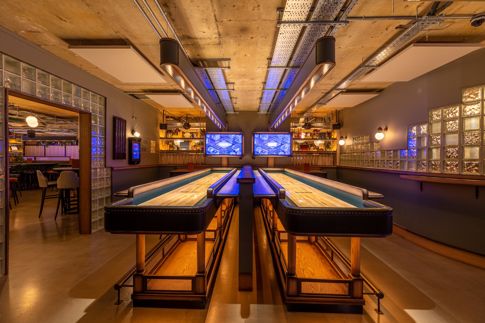Modern event space with sleek bowling lanes for networking and team-building in Leeds.