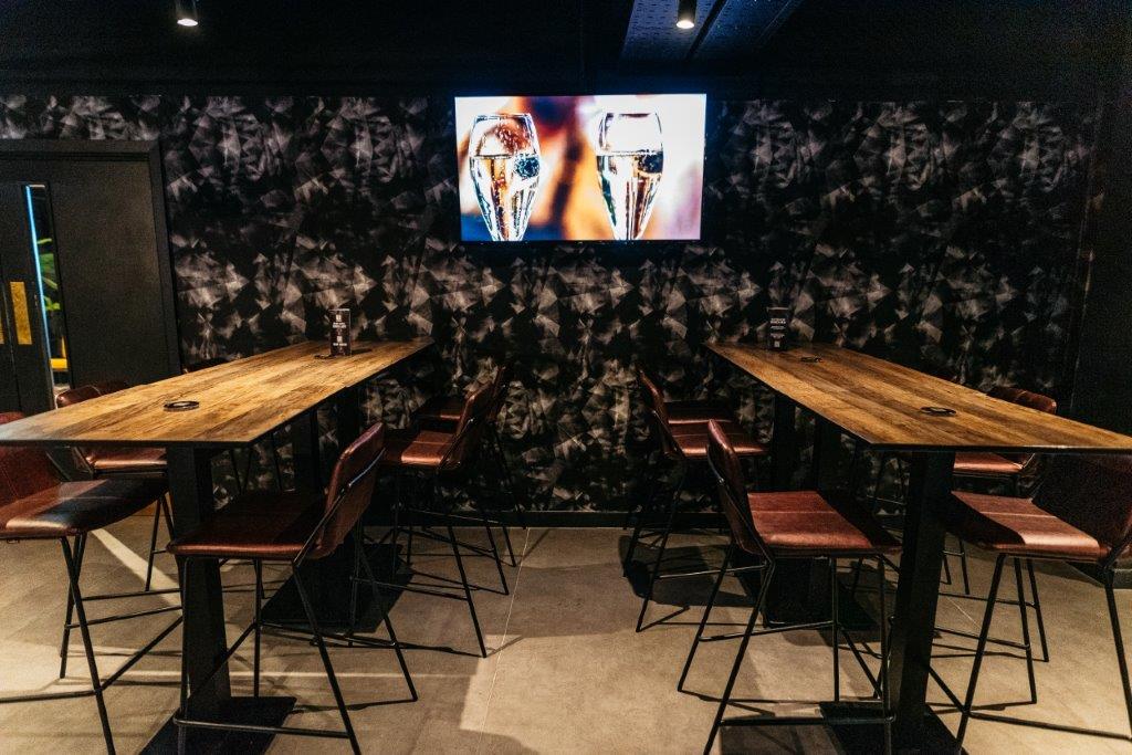 Modern meeting space in Par 59 Cardiff with high-top tables for networking events.