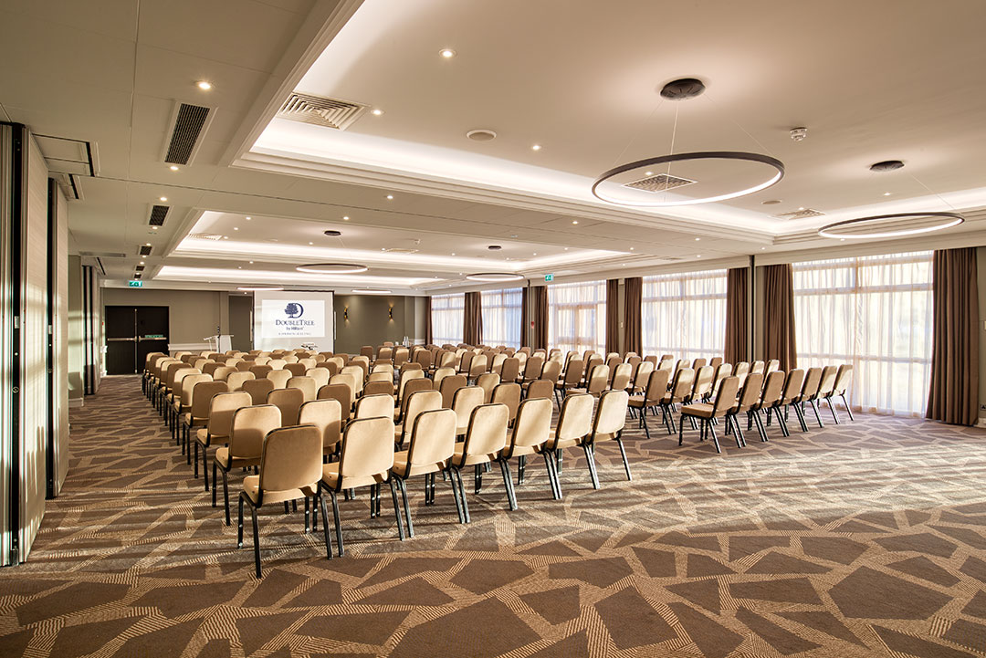 Ealing Suite conference room with beige chairs, ideal for meetings and workshops.