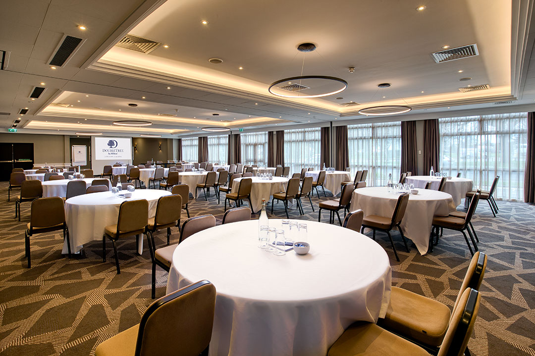 Ealing Suite at DoubleTree London Ealing, elegant meeting space with natural light.