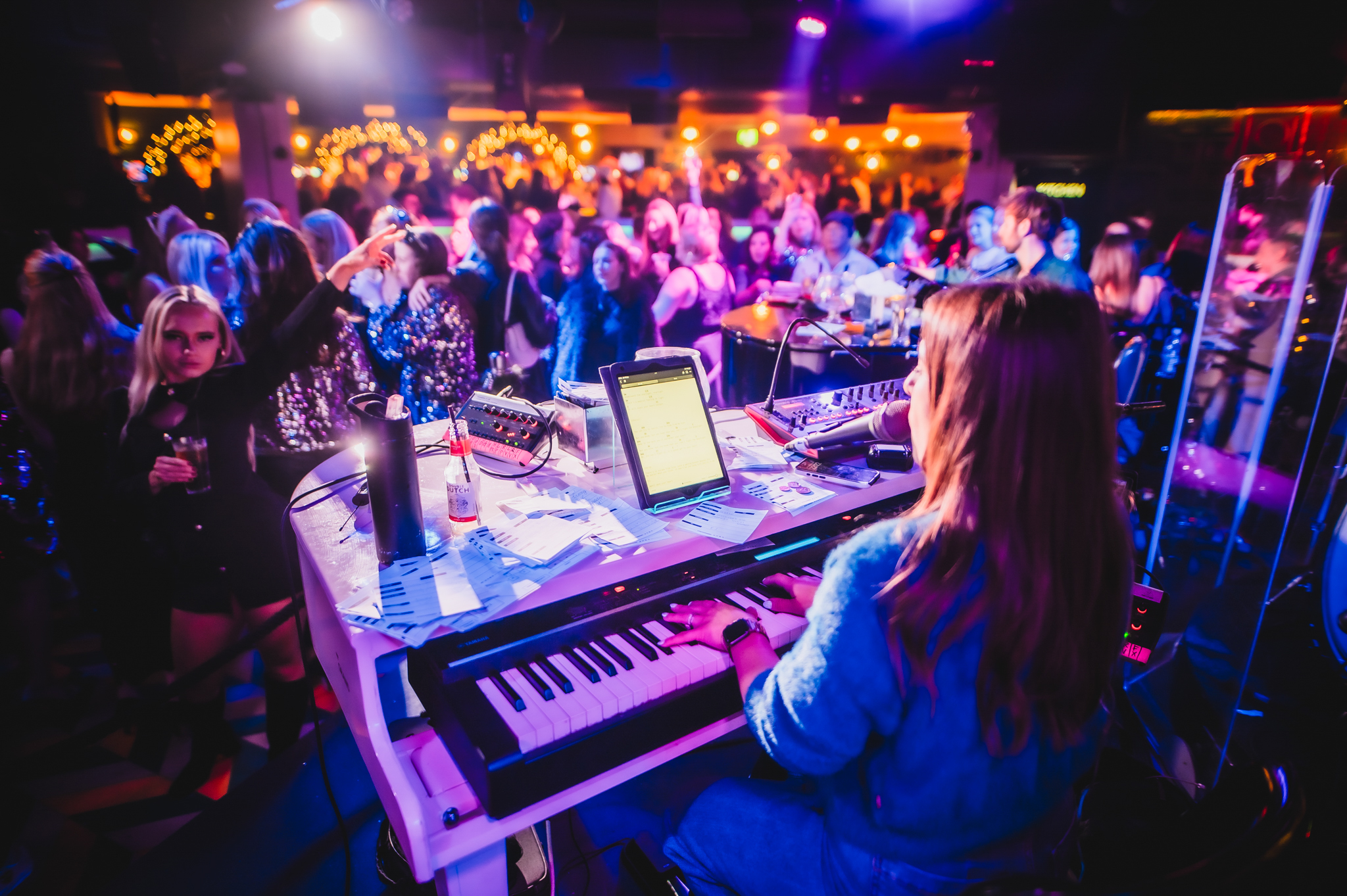 Live band performing at The Piano Works Farringdon, vibrant event atmosphere, networking.