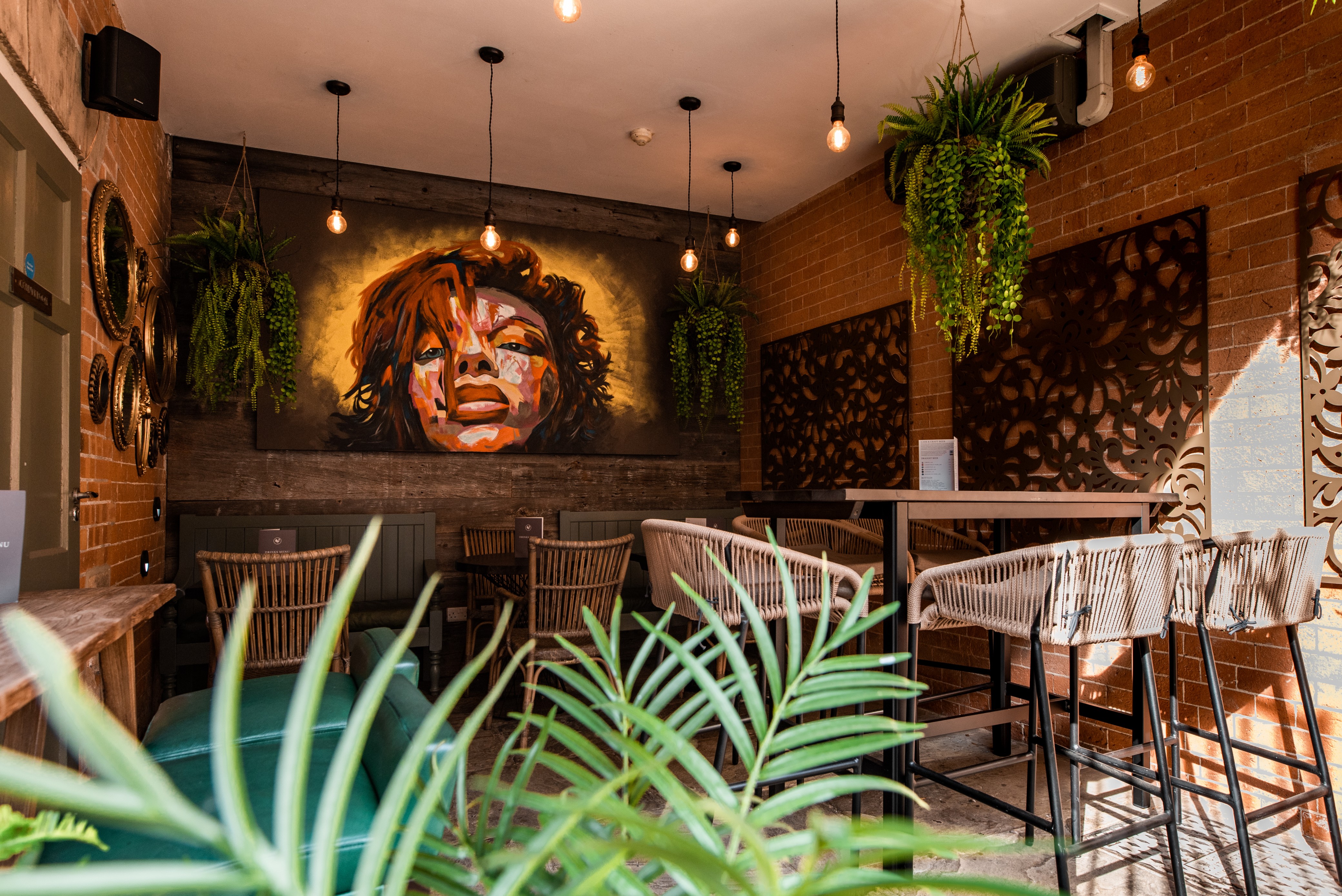 Stylish Flagstaff in Lace Market Hotel with vibrant mural, ideal for networking events.