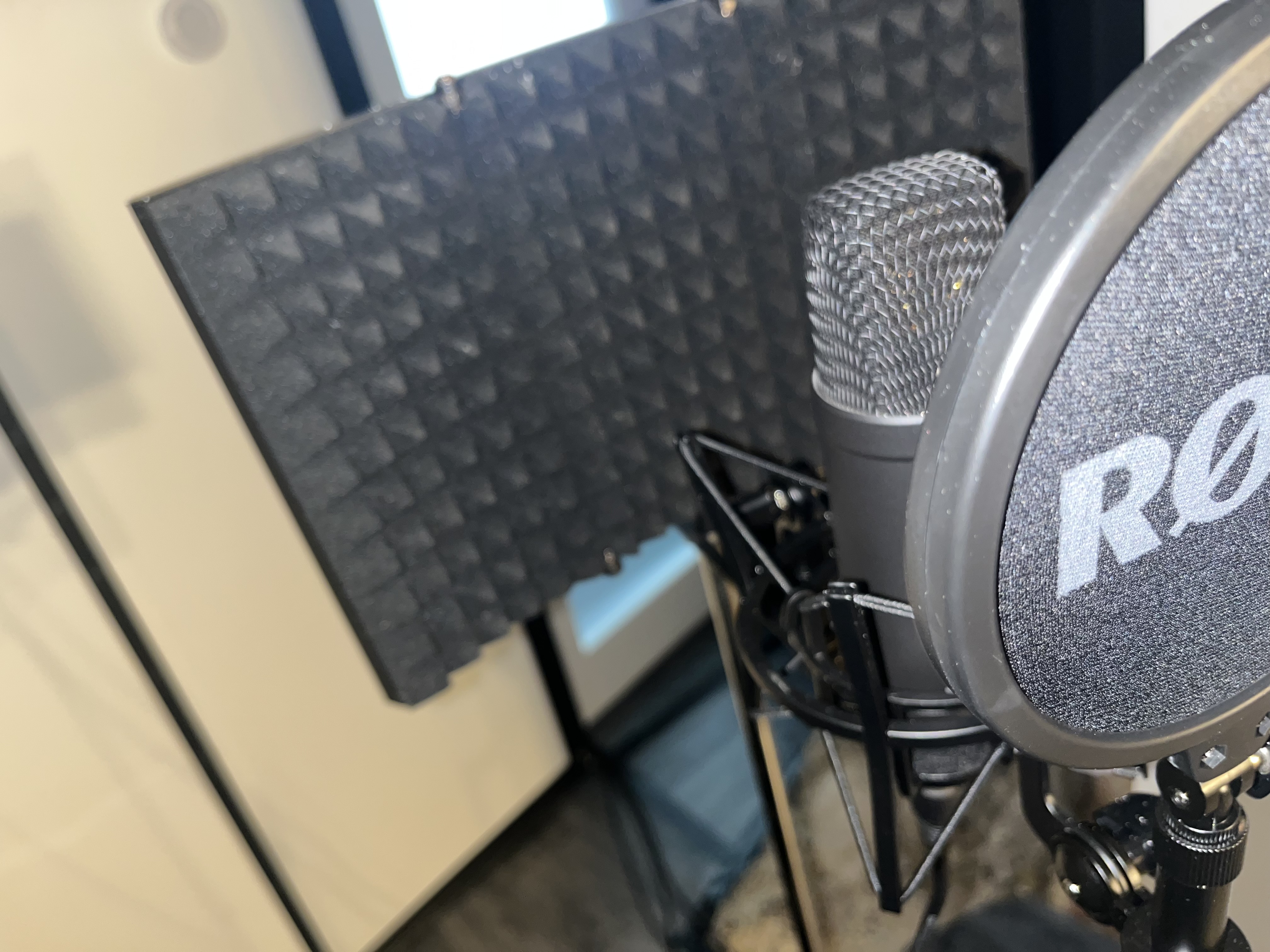 Professional audio setup with microphone and soundproofing for virtual events.