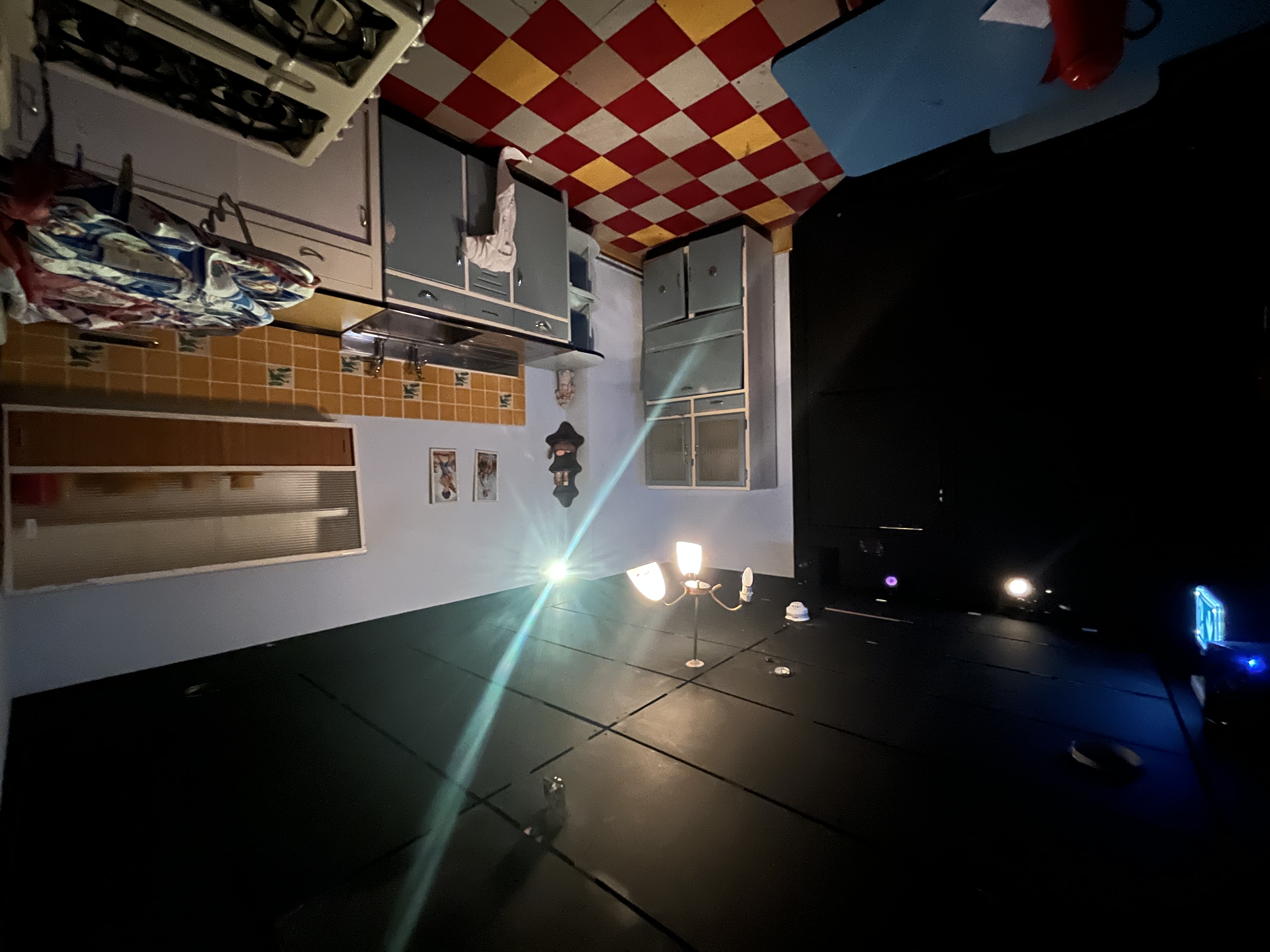 Spooky Escape Room kitchen set with checkered floor for immersive events and workshops.