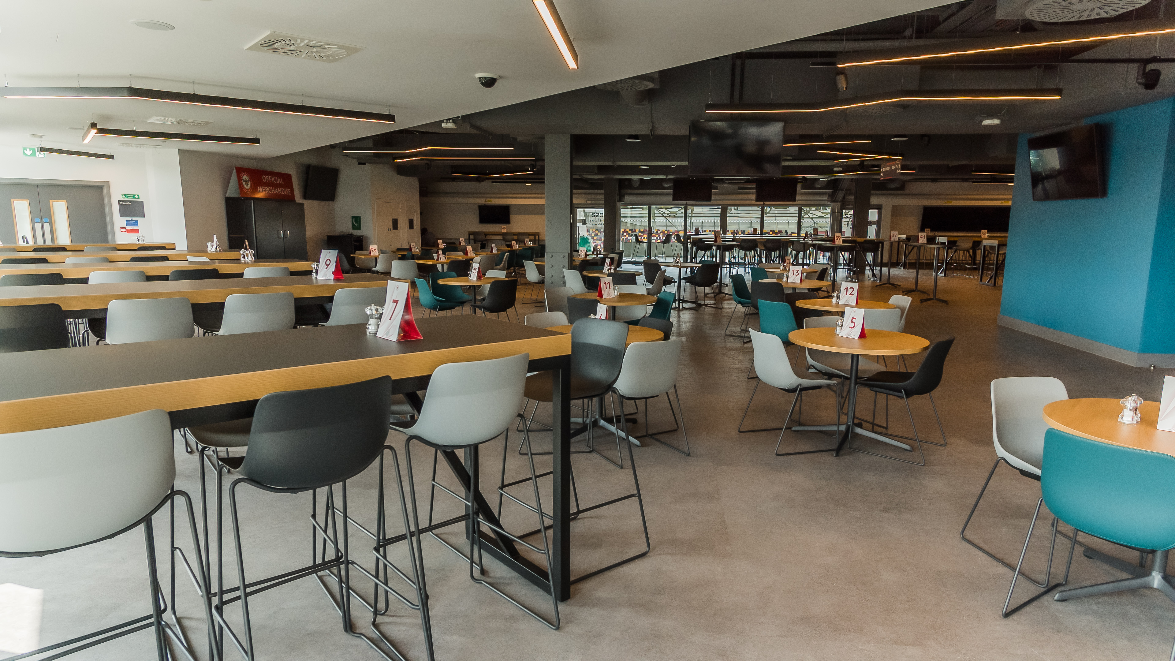 Legends Suite at Brentford FC: modern event space with natural light for meetings and gatherings.