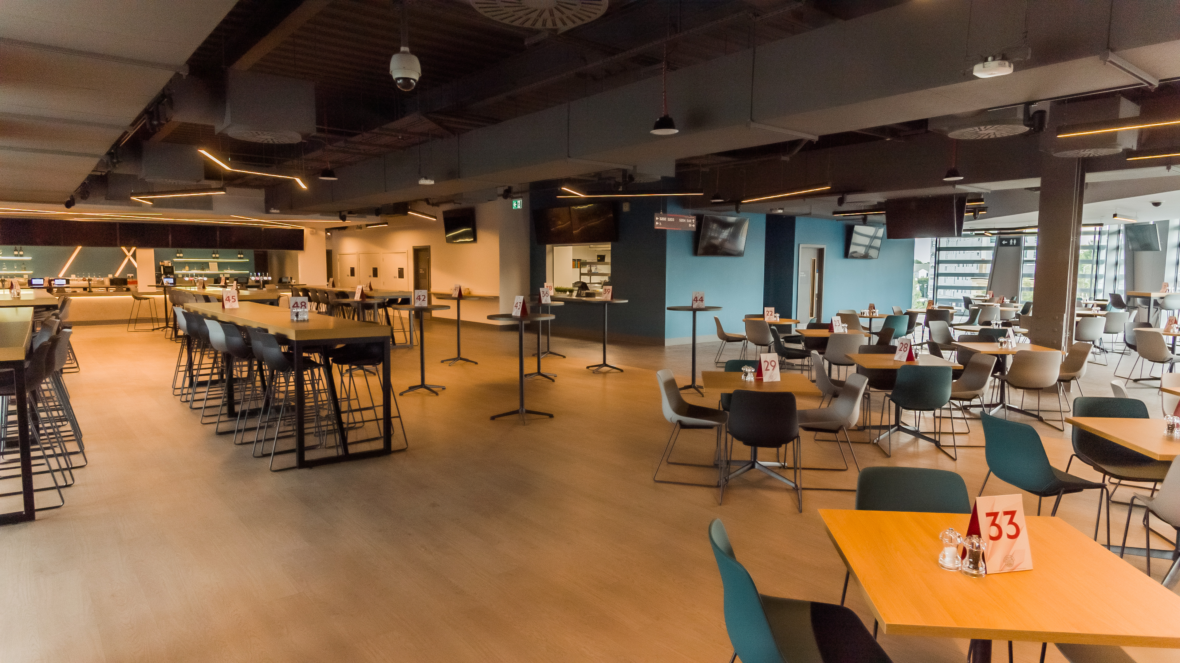 Legends Suite at Brentford FC: modern event venue with flexible seating for networking.