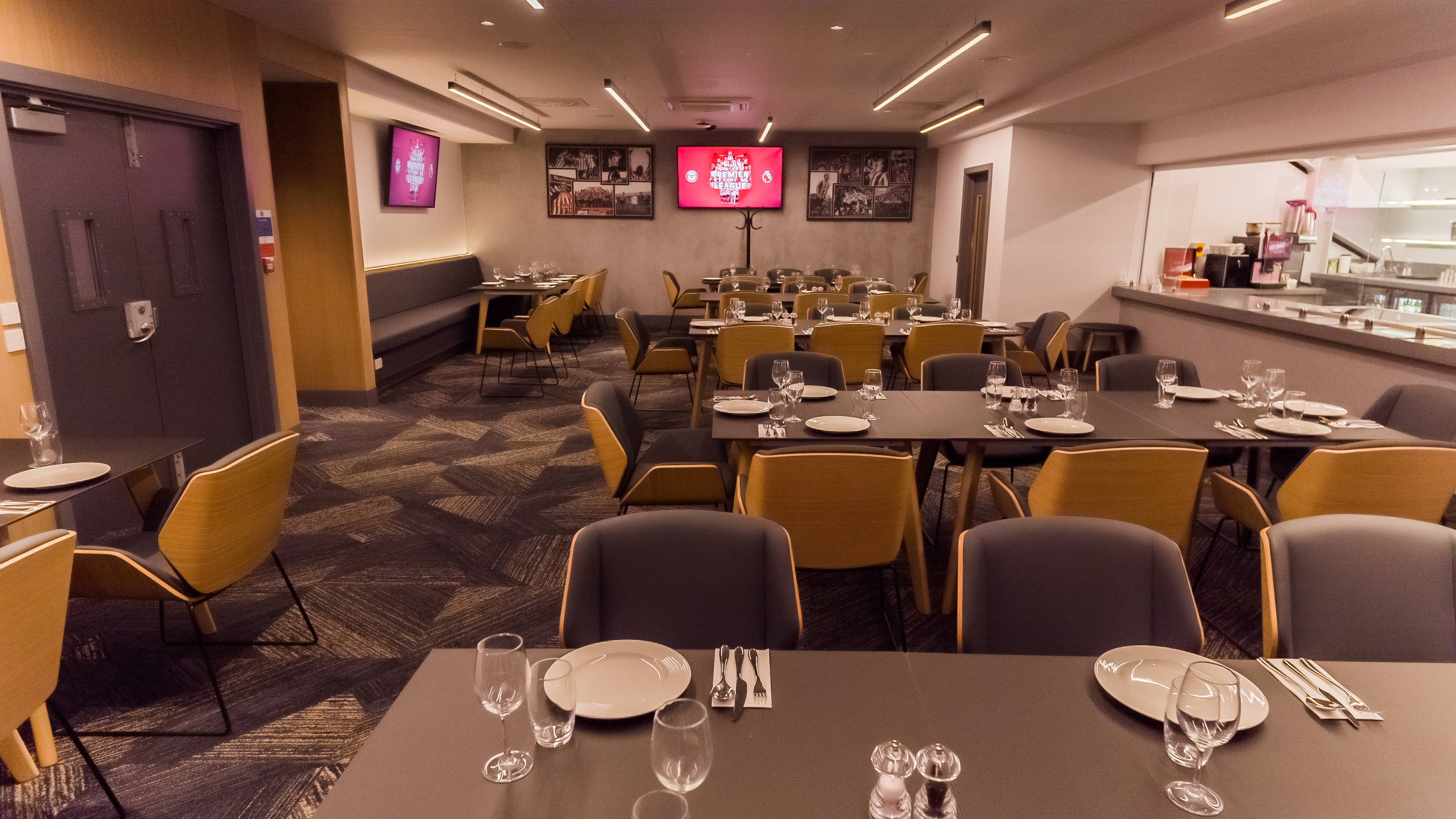The Boardroom at Brentford FC: elegant dining space for corporate events and gatherings.