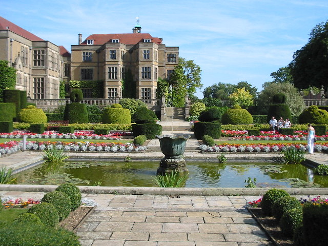 Fanhams Hall garden venue with manicured hedges, ideal for weddings and events.