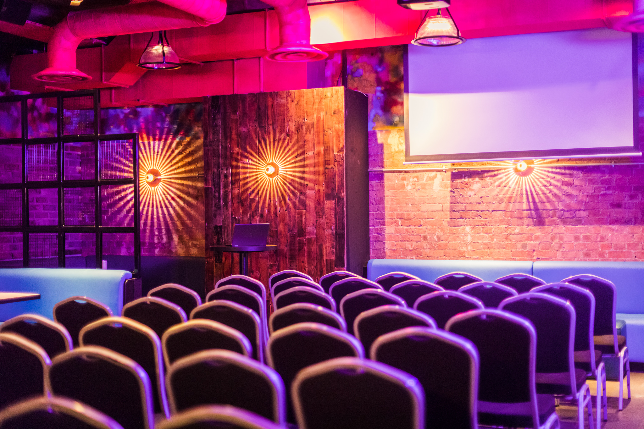 Stylish event space at Lucky Voice Liverpool Street with vibrant lighting for gatherings.