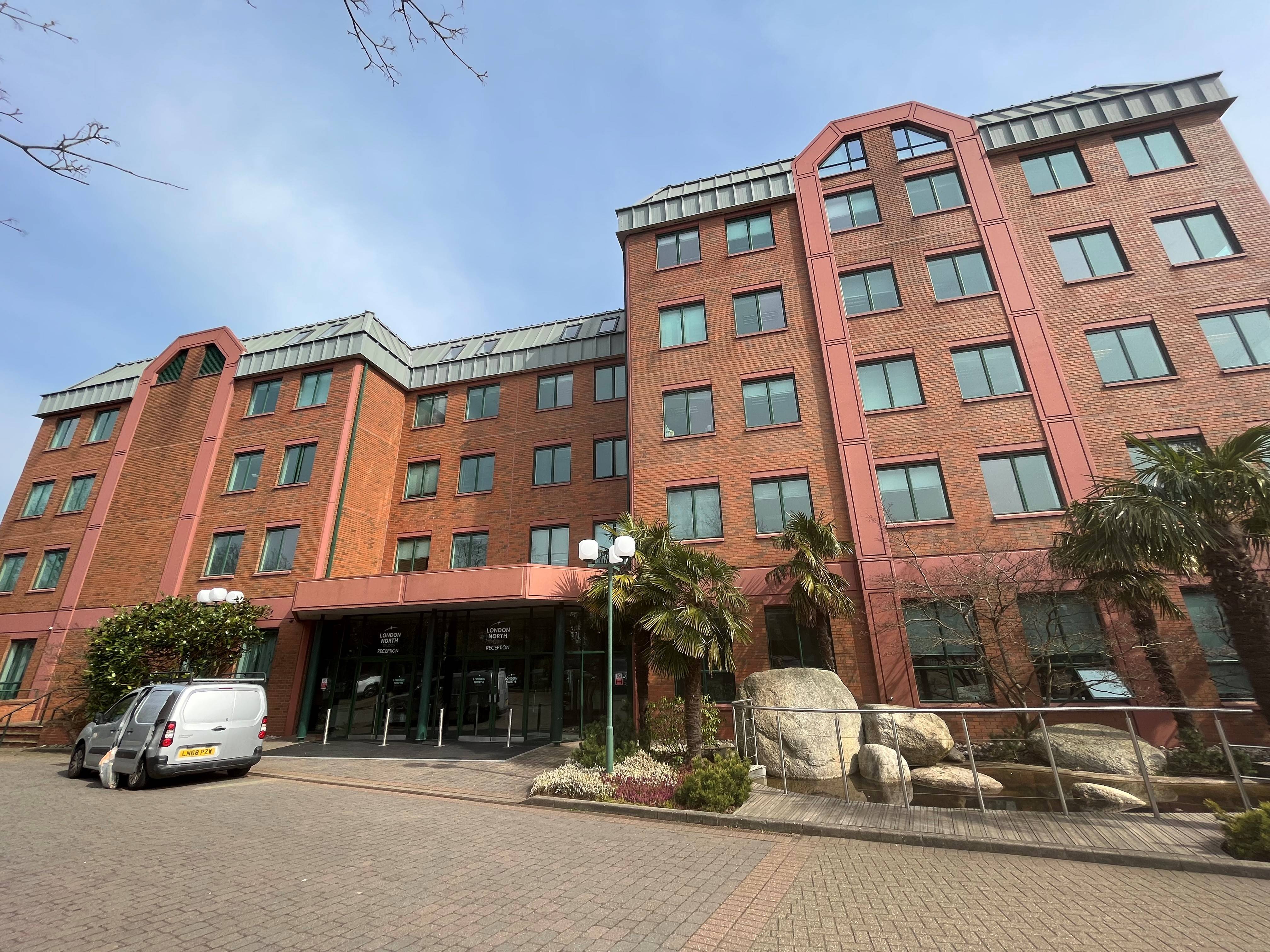 Modern hotel dining hall in London, featuring brick and glass facade for events.