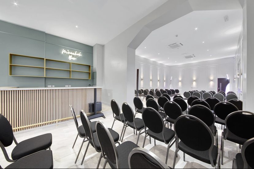 Modern event space in Mnuchah with sleek reception, ideal for conferences and workshops.