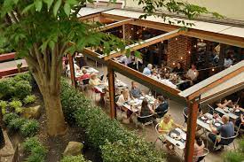 Private dining room at Mediterra Restaurant, vibrant outdoor space for events and gatherings.