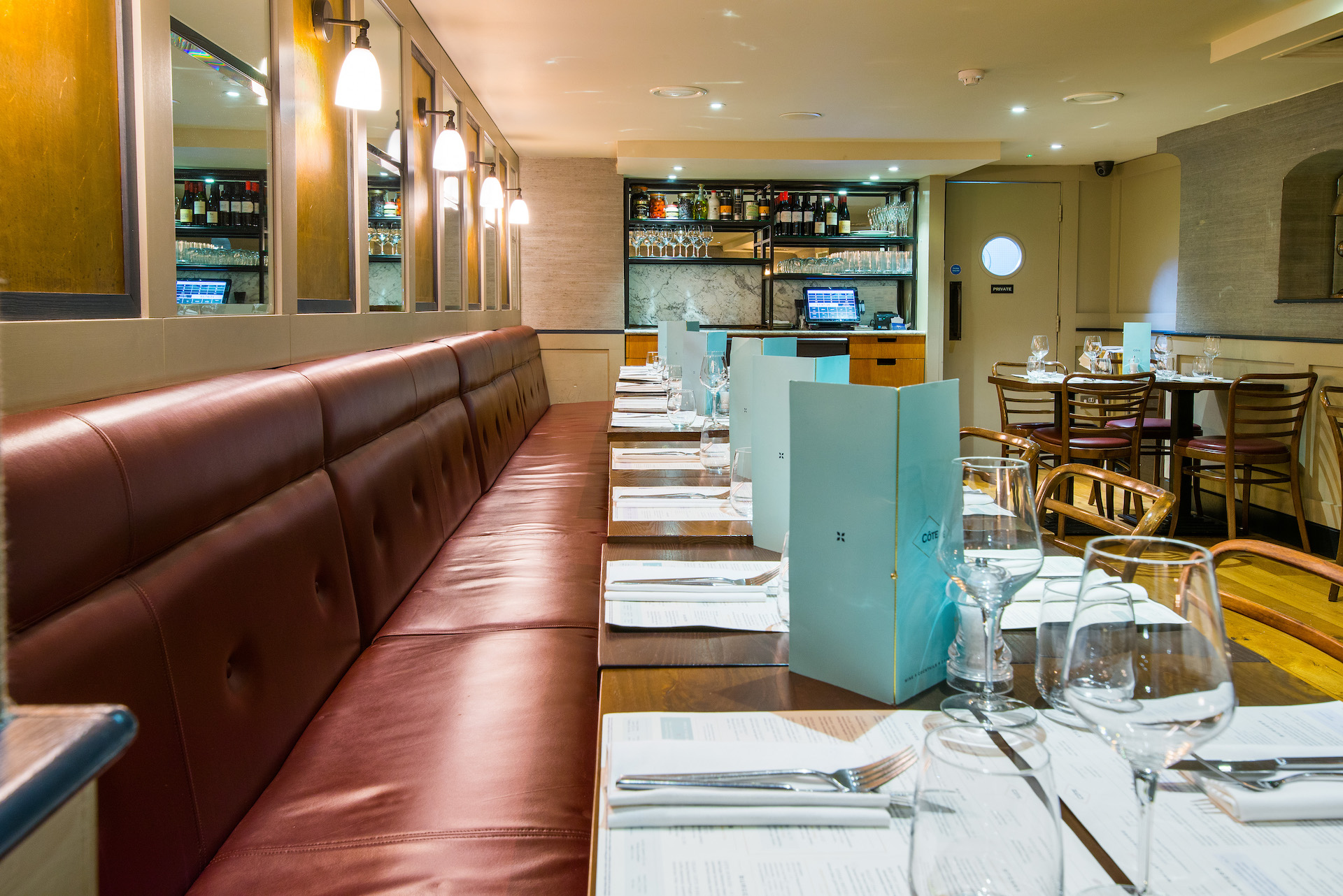 Private dining room at Cote Brasserie, elegant setting for intimate gatherings and corporate events.