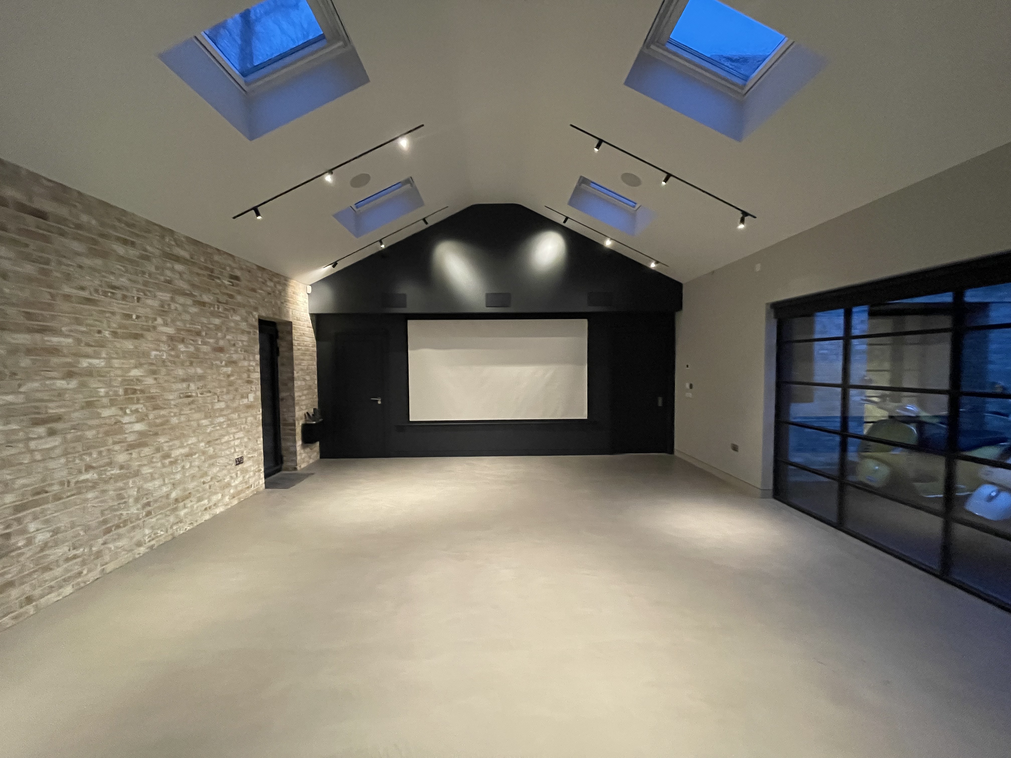 Modern event space with high ceilings, ideal for corporate meetings and workshops.