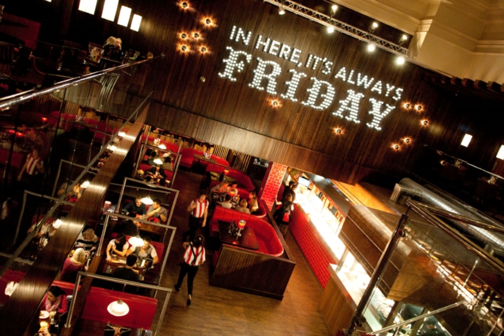 Vibrant dining space at Fridays Royal Exchange, ideal for casual meetings and celebrations.
