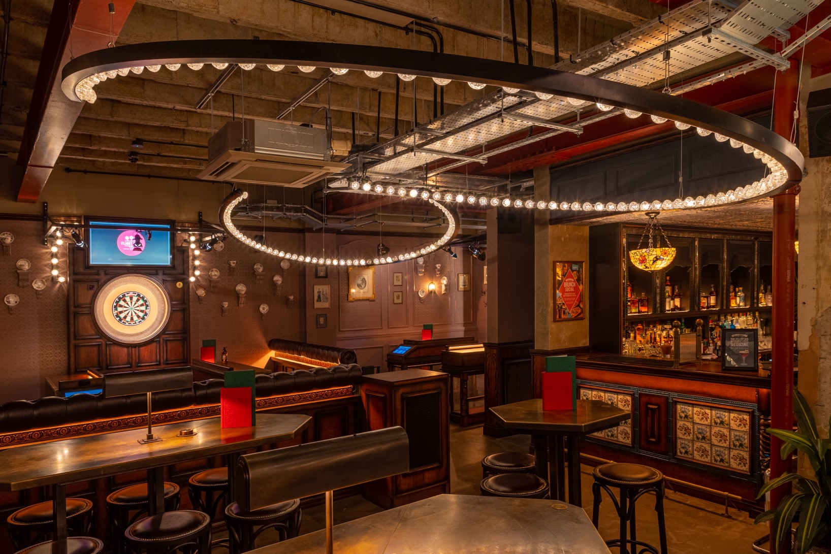 Stylish event space with modern lighting at Flight Club Cardiff for gatherings and corporate events.