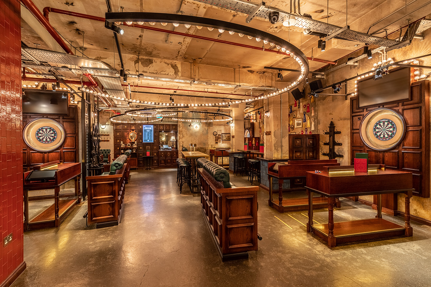 Stylish event space with dartboards for corporate functions and social gatherings.