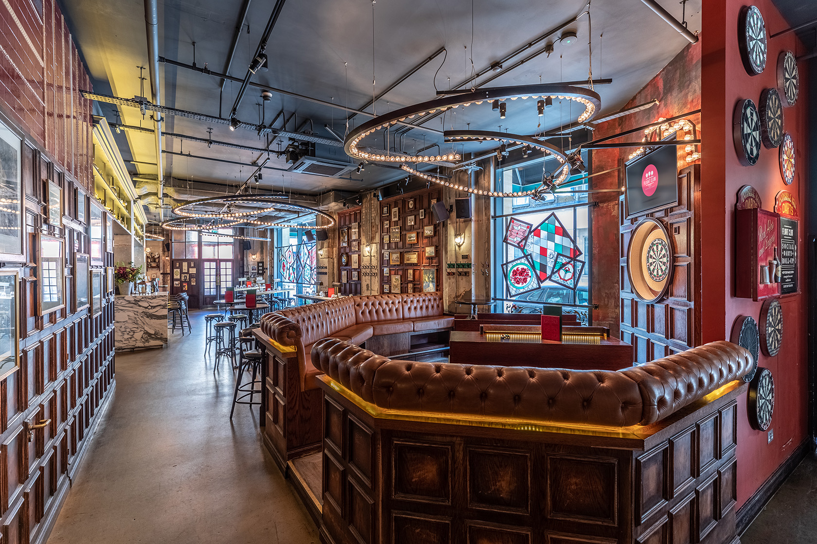 Full Venue Hire at Flight Club Shoreditch with cozy seating and dartboards for events.