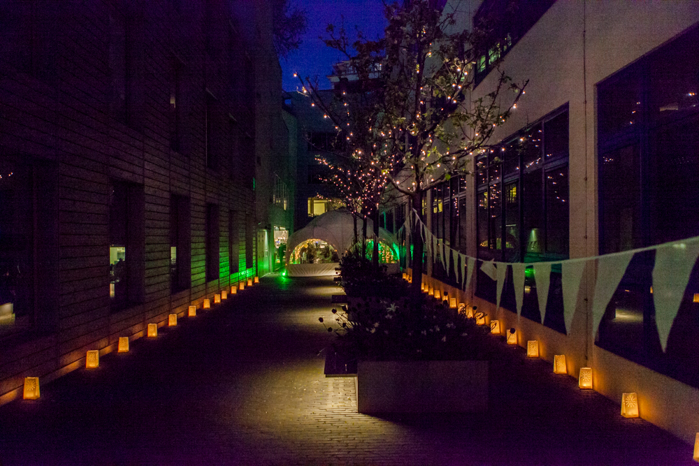 Outdoor illuminated cafe with lanterns, perfect for evening receptions and gatherings.