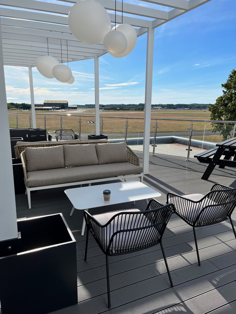 Stylish outdoor lounge at SmartBase, perfect for networking events and casual meetings.