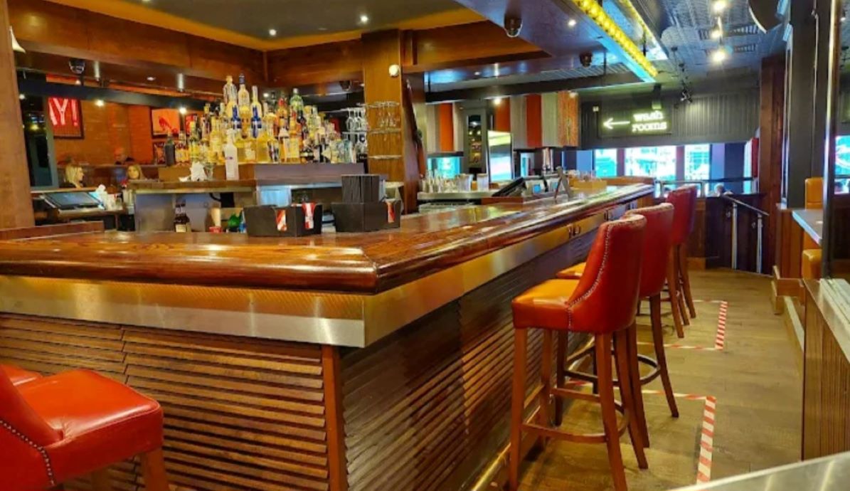 Full Venue Hire bar in Glasgow with polished wood counter, ideal for networking events.