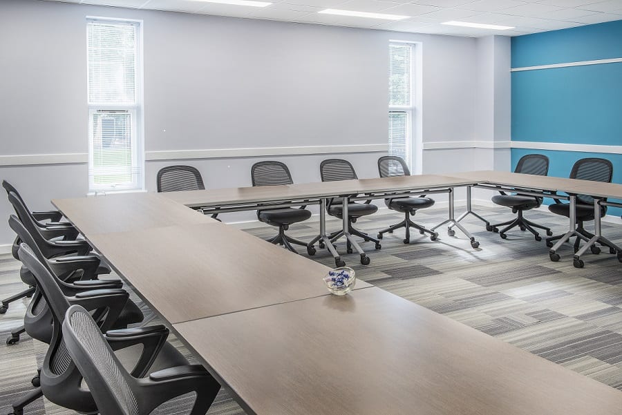 "De Vere Latimer Estate meeting room with U-shaped table for workshops and strategy sessions."