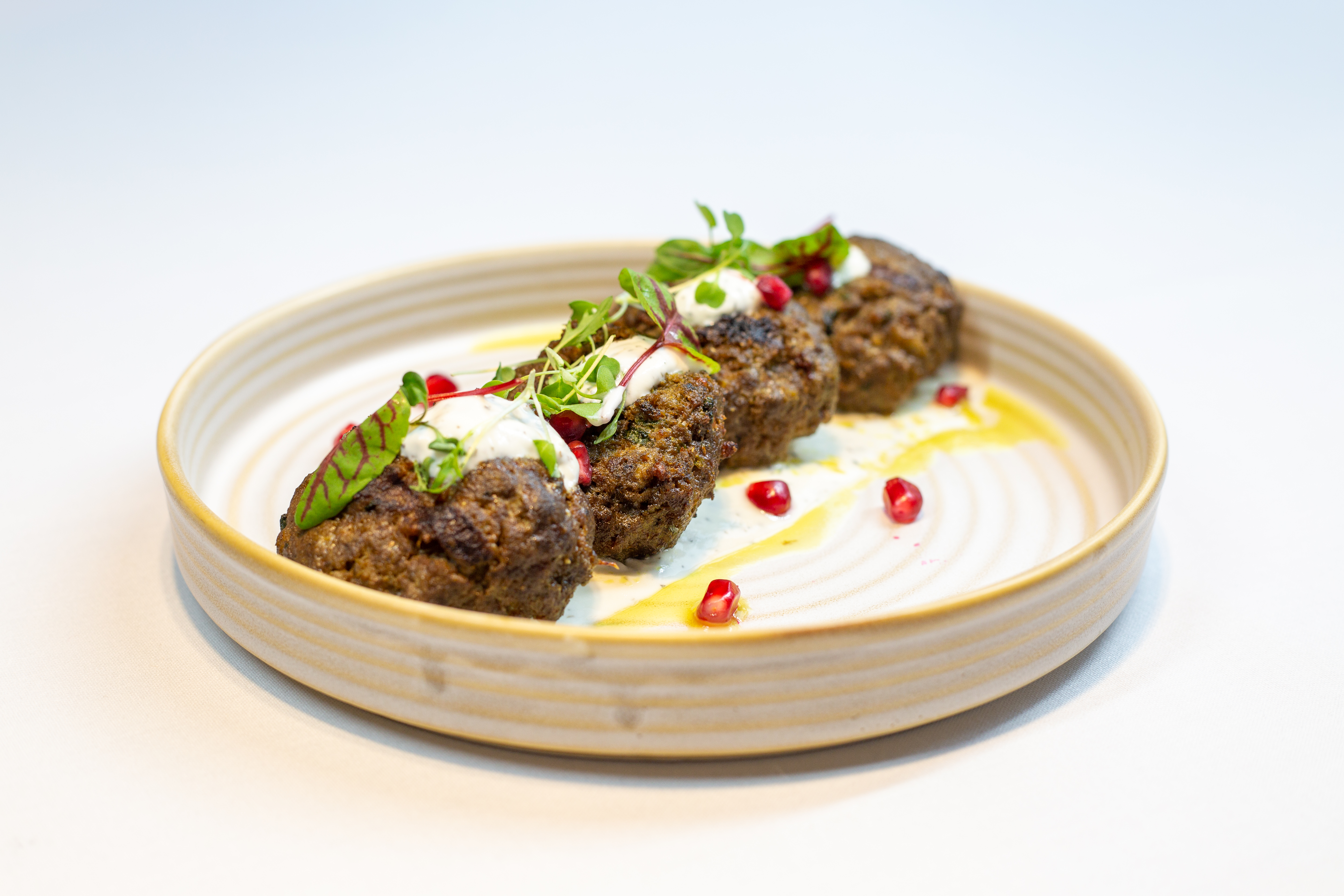 Elegant meatballs with herbs and pomegranate at DoubleTree London Ealing catering event.