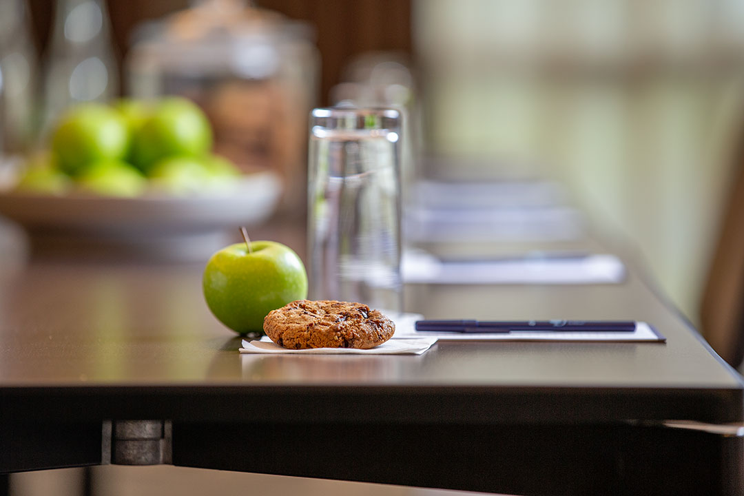 Townshend Suite meeting setup with conference table, snacks for corporate events.