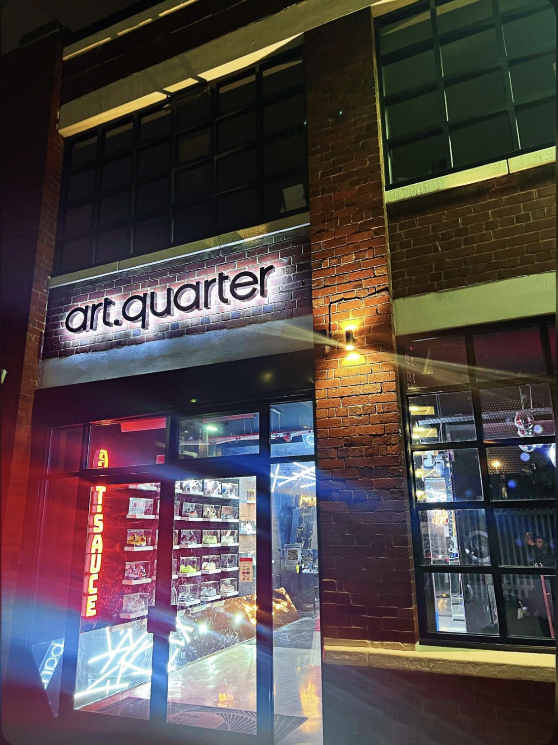 Modern art venue "art.quarter" with illuminated signage, perfect for creative events.