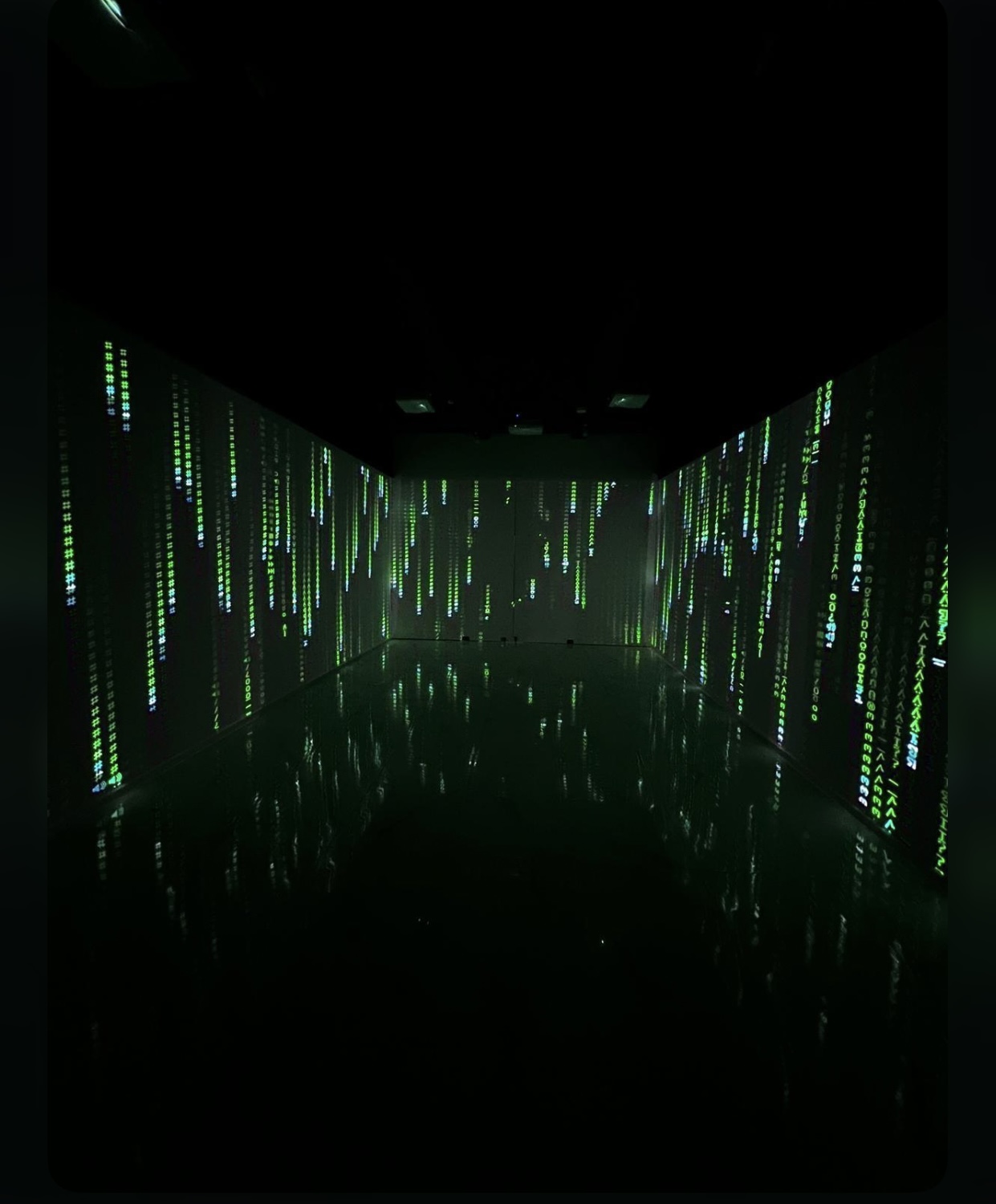 Dynamic Art Quarter event space with immersive green lighting for innovative presentations.