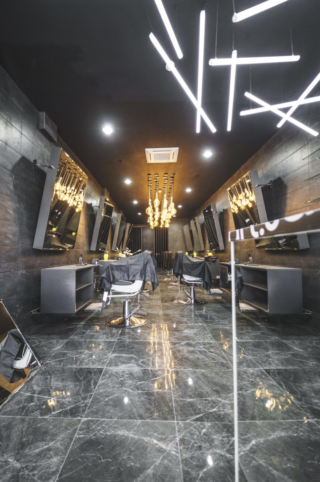 Modern salon space with elegant lighting, perfect for beauty events and workshops.