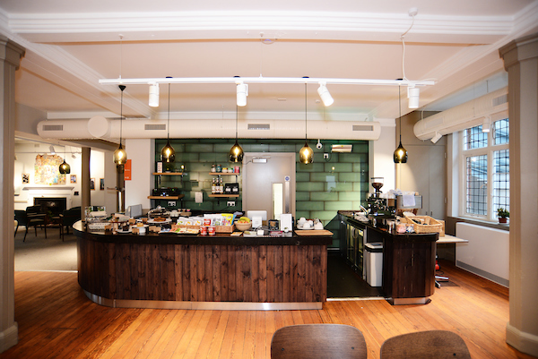 Stylish café in Oxford House, ideal for networking events with warm wood tones.