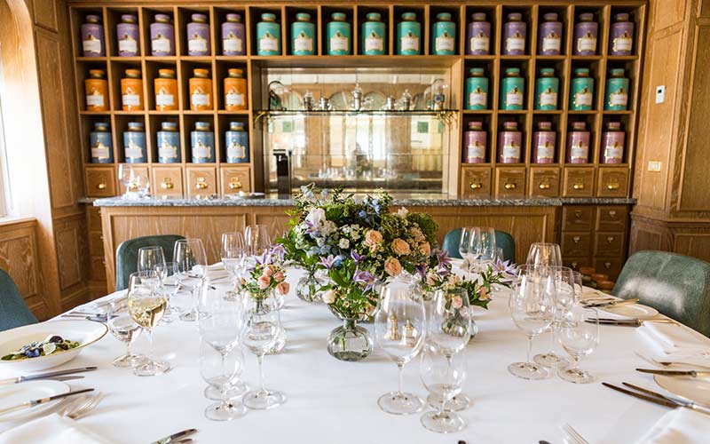 Elegant dining table with floral centerpiece at Hyatt Fortnum and Mason for upscale events.