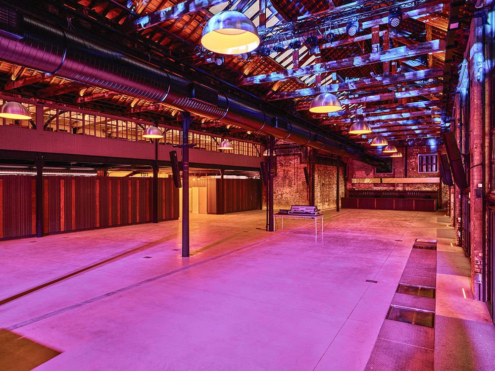 Main Event Space in Boiler Shop with exposed beams, ideal for corporate and social events.